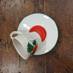 Hand painted ceramic coffee cups with strawberry decorations