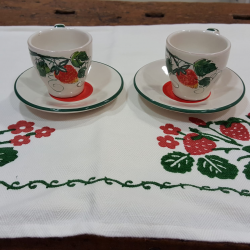 Hand painted ceramic coffee cups with strawberry decorations