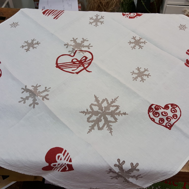 Square Christmas tablecloth. Flakes and hearts