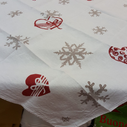 Square Christmas tablecloth. Flakes and hearts