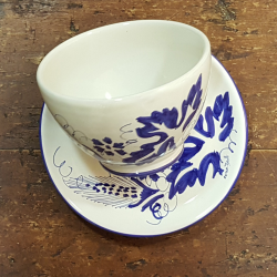 Bowl over ceramic saucer