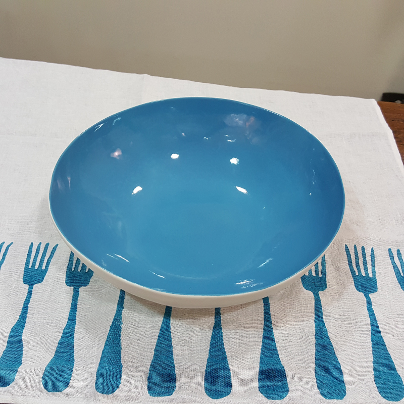 Porcelain bowl with azure background