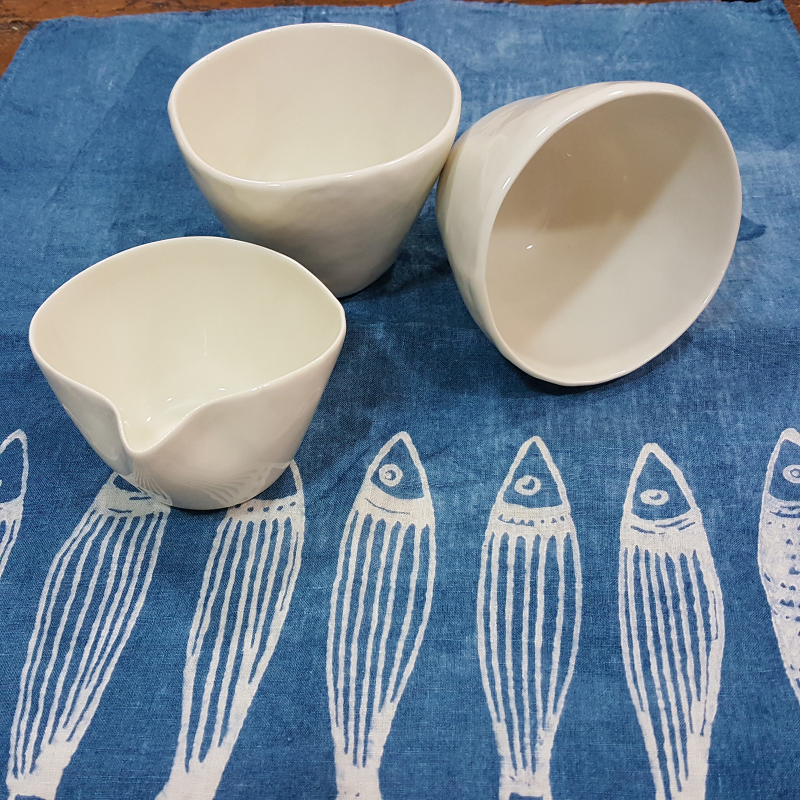 Pair of porcelain teacups with milk jug