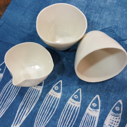 Pair of porcelain teacups with milk jug