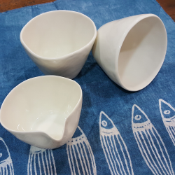 Pair of porcelain teacups with milk jug