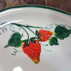 Round ceramic serving dish decorated with strawberries